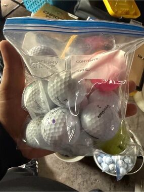 Pack of Assorted White Golf Balls with a Few Colored Balls
